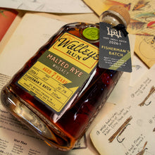 Load image into Gallery viewer, Bottle of Walleye Malted Rye Whiskey on a surface with documents and a tag.