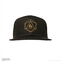 Load image into Gallery viewer, Black Dungeons & Dragons flat-brim hat featuring a gold embroidered d20 design with the ampersand dragon logo at the center.