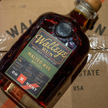 Load image into Gallery viewer, Bottle of Walleye Rum Malted Rye on a cardboard box background