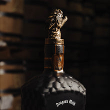 Load image into Gallery viewer, Bottle of 'Origin' whiskey with a dragon design on a wooden barrel
