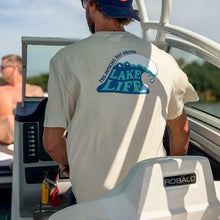 Load image into Gallery viewer, Person on a boat wearing a 'Lake Life' t-shirt with a Robalo logo.
