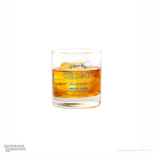 Load image into Gallery viewer, Dragon’s Milk d20 Brew stemmed beer glass and Origin Mead Cask whiskey glass shown together, featuring Dungeons &amp; Dragons dragon artwork and collaboration branding.
